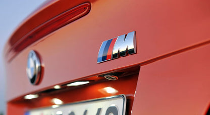 M badge on car