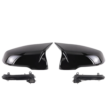 Pair of black car side mirrors on a white background