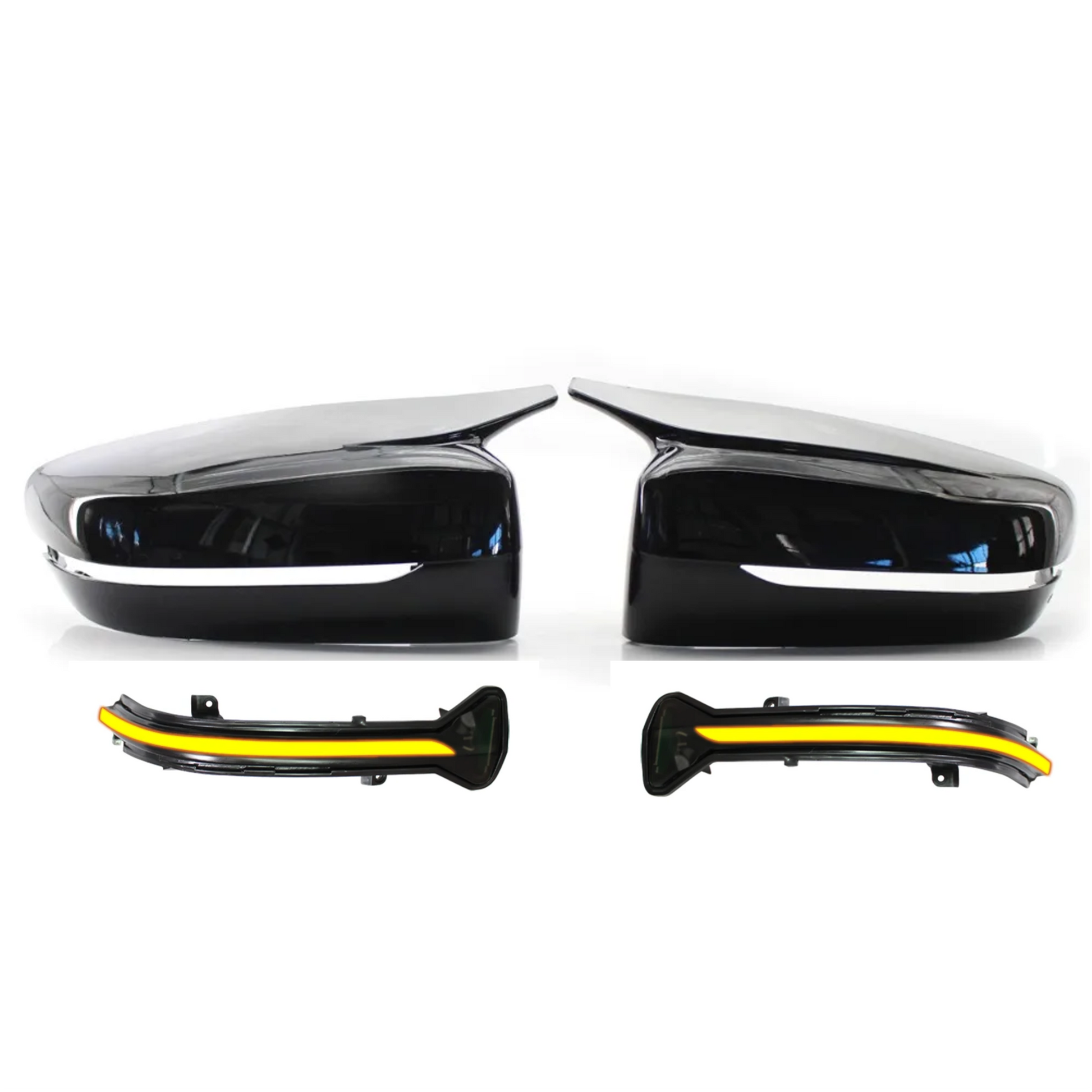 Car side mirrors and turn signal light covers on a white background