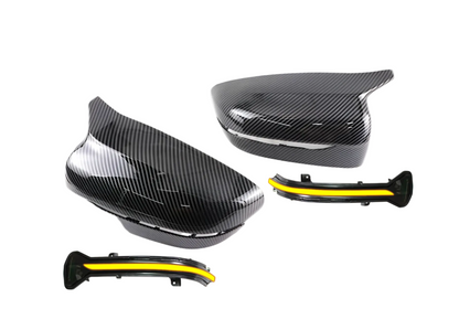 Carbon fiber motorcycle parts with yellow accents on a white background